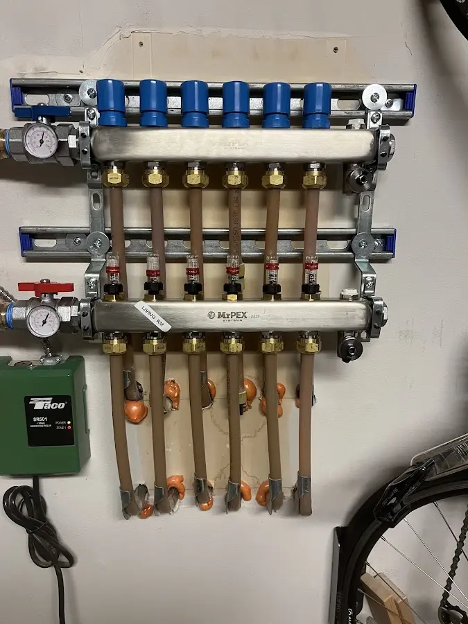 Plumber performing Water Heater Repair at a residential property in Martins Ferry